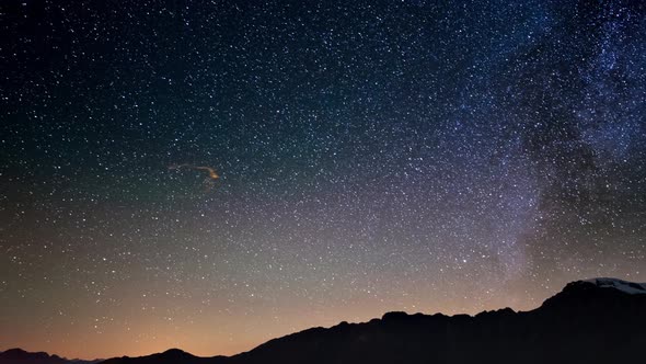 Meteor explosion, meteor shower and stardust smoke trail in night sky, time lapse of the Milky Way