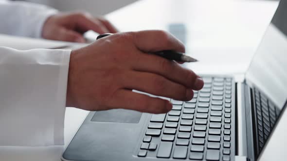 Electronic Medical Record Male Doctor Hands Laptop