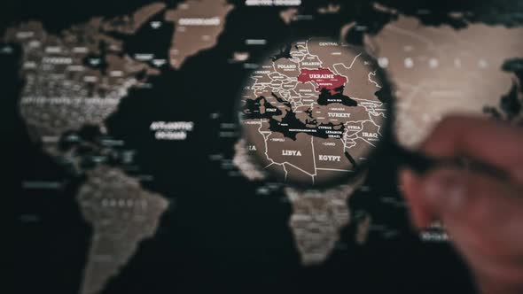 Ukraine on the World Map Under a Magnifier Loupe Worldwide Attention to War