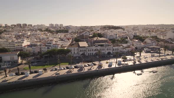 Riverside promenade at sunrise, Lagos , Algarve. Aerial cinematic view