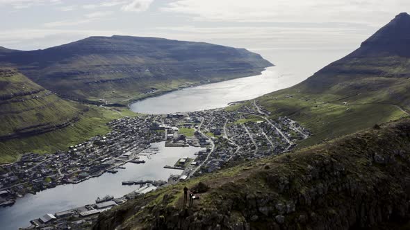 Drone Over Hikers On Klakkur With Klaksvik Town Below