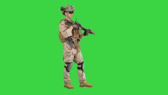 Soldier Standing and Listening Orders on a Green Screen, Chroma Key.