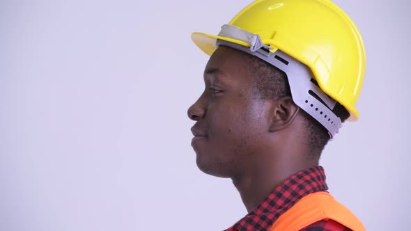 Closeup Profile View of Happy Young African Man Construction Worker Smiling