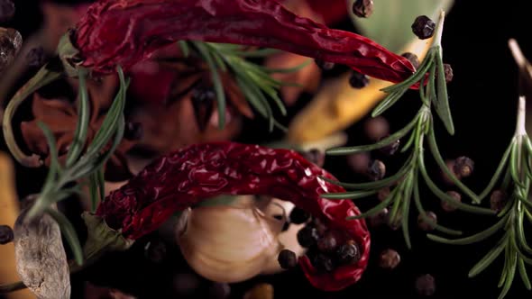 Super Slow Motion Shot of Flying Mix Spices in Black Background