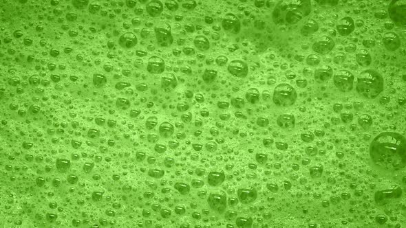 Green Foam With Bubbles Popping