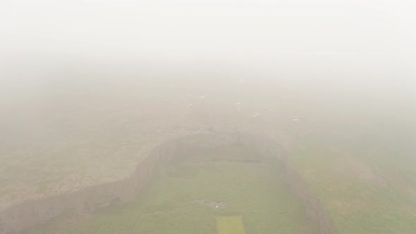 Aerial View Of Asbyrgi Canyon In Iceland All Covered By Mist And Clouds - drone shot