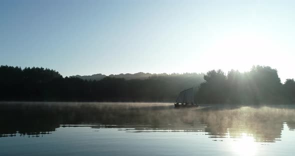 Morning Flight Over The Lake In Ukraine. The Boat Is Floating.