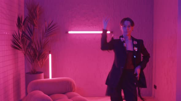 Teenager Dancing in Pink Lights