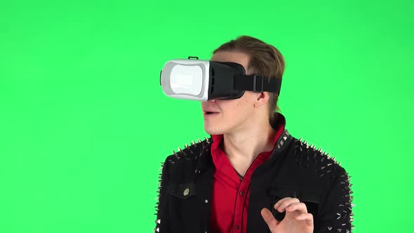 Guy with Virtual Reality Headset or 3d Glasses . Green Screen