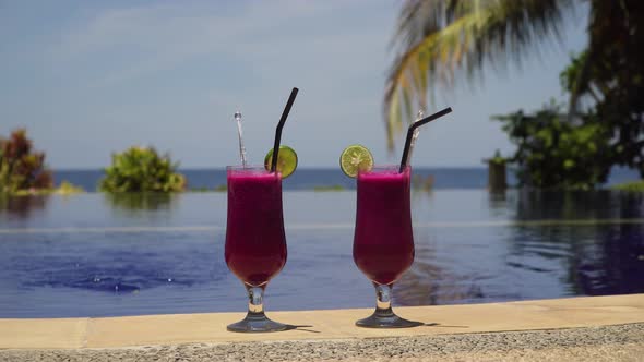 Glasses with a Cocktail Near the Pool