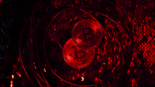Man Hand Throws Red Bitcoin Coin is Connected to the Internet By Blue Flashing Wire