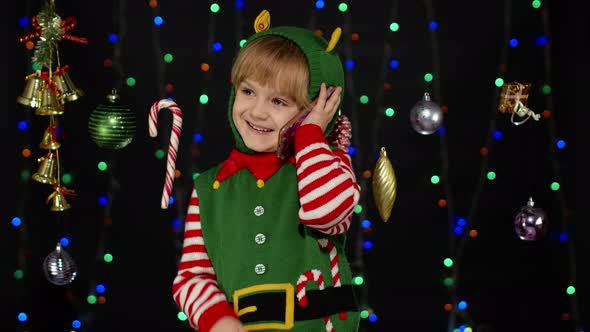 Kid Girl Christmas Elf Santa Claus Helper Costume Making Congratulations Call Mobile Phone