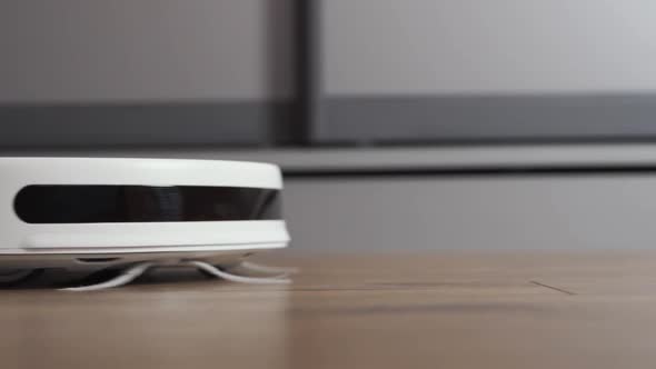 The Automatic Robot Vacuum Cleaner Moves Along Its Trajectory