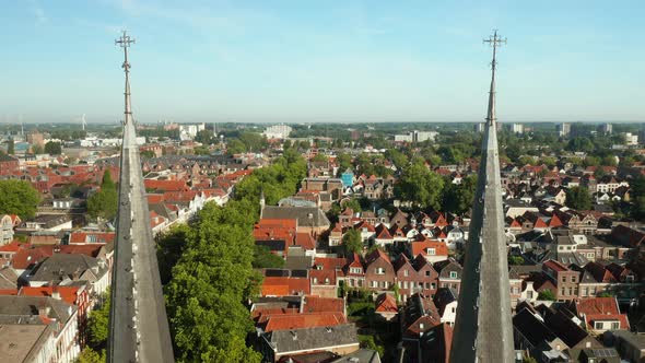 Passing Over The Structure Tip Of Gouwekerk With Panoramic Complex View In Gouda, Netherlands. Drone