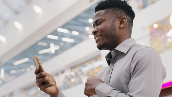 Young African American Man Talking on Mobile Phone on Webcam Looking at Screen Smartphone Friendly