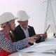 Two engineers working on the construction of high-voltage power. Teamwork, Leadership - VideoHive Item for Sale