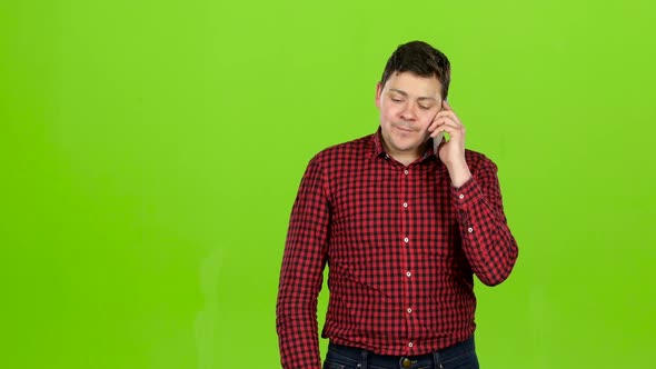 Man Dials a Familiar Number and Starts Talking. Green Screen