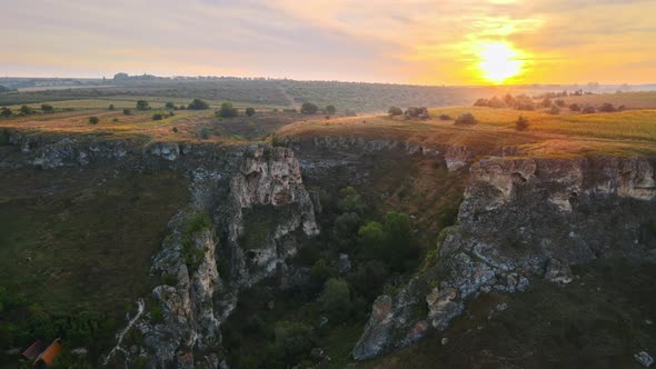 Aerial drone view of the Duruitoarea natural reservation at sunset in Moldova. The Gorge, village