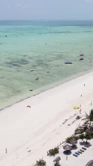 Vertical Video Kitesurfing Near the Shore of Zanzibar Tanzania