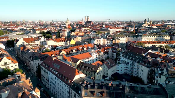 Panorama aerial view Munich downtown sunrise. Drone flies over residential area of central bavarian