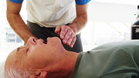 Male paramedic during cardiopulmonary resuscitation