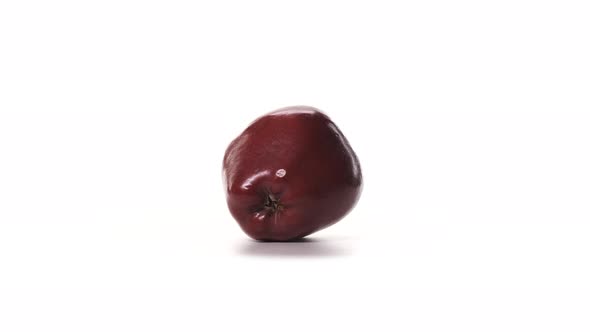 Fresh Red Apple Spinning on White Background