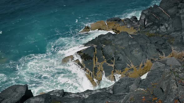 Waves Breaking Over Big Rocks Coastal Landscape