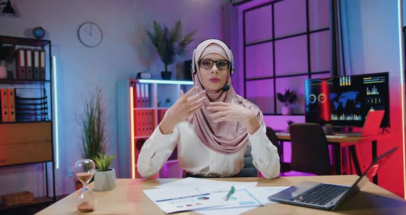 Businesswoman in Hijab which Wearing Headset During Recording Video for Internet Channel