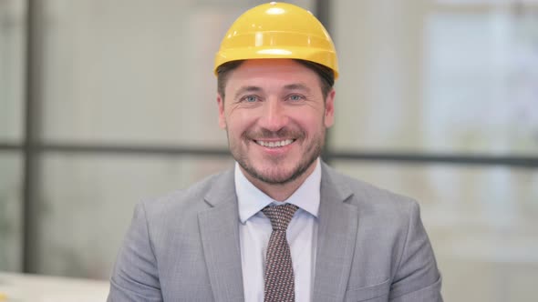 Portrait of Attractive Middle Aged Engineer Smiling at Camera