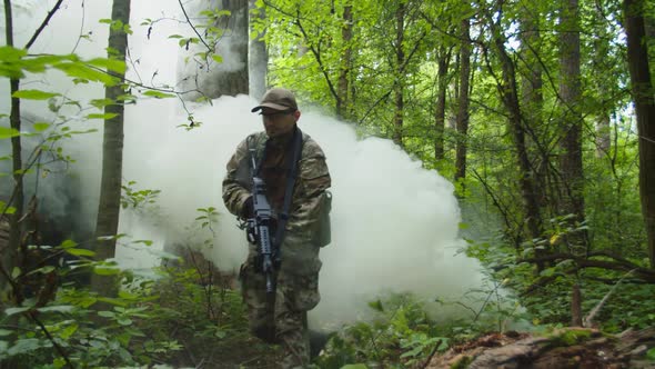 Military Female Soldier with Rifle Overcoming Obstacles in Forest