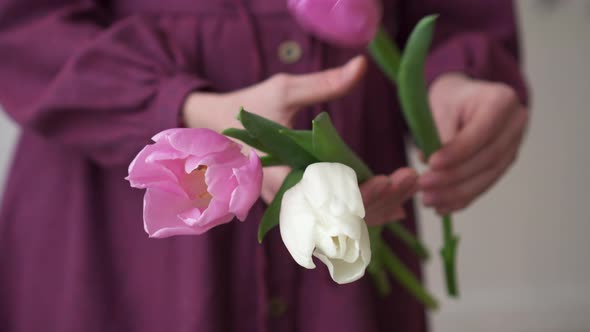 Close-up of Florist Gathering Bouquet of Tulip Flowers