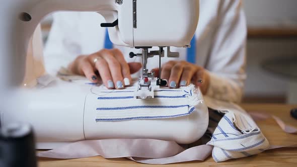 Female Hands Working on Sewing Machine