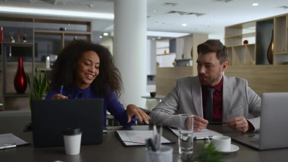 Multiethnic Coworkers Team Brainstorm Business Marketing Plan in Company Office