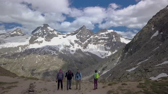 Tourists on a Pass in the Alps