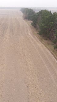 Vertical Video of a Field with Plowed Land in Autumn Slow Motion