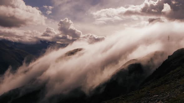 Fog Clouds Moving Fast over Mountain Landscape