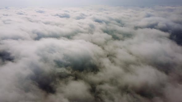 Aerial Perspective View of Flying Over Clouds