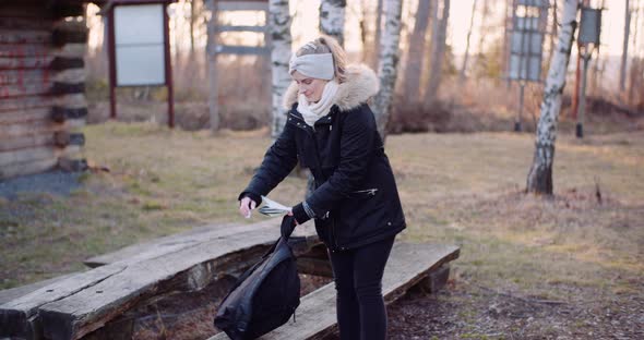 Female Tourist Taking a Brake During Walk in Mountains