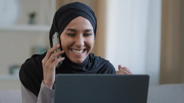 Happy Smiling Arabian Woman Muslim Girl in Hijab Female Freelancer Talking By Mobile Phone with