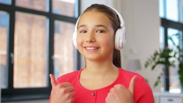 Teenage Girl Blogger in Headphones at Home