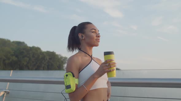 Athlete Woman Drinking Energy Drink After Training