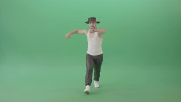 Man dancing popping street dance and makes crazy move isolated on green screen