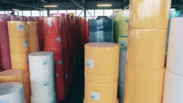 Big Colourful Paper Rolls Stored at a Warehouse