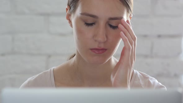 Reaction of Frustration by Woman in Loft Office