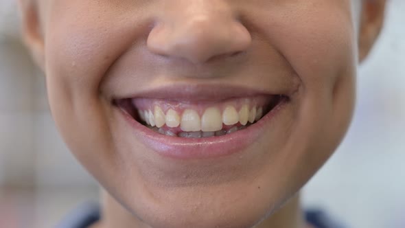 Close Up of Mouth of Smiling African Woman Looking at Camera