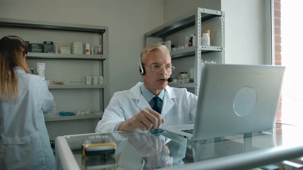 Pharmacist Preparing Online Order for Client in White Paper Package