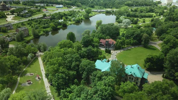 Flight Over The City Park. You Can See Park Buildings. Aerial Photography