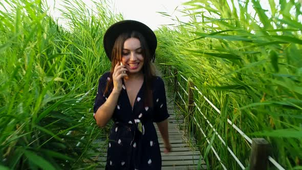 Woman Talking On The Phone Smiling