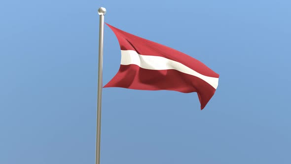 Latvian flag on flagpole.