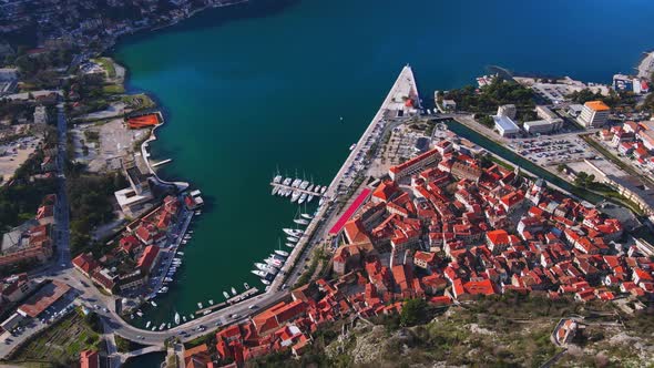 Drone with Camera Flies Over Old European Town of Kotor in Montenegro From Bay with Pier to Medieval